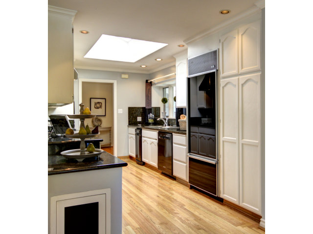 1432 Brookmill Road Los Altos, CA 94024 - Photo 8 of 21 a kitchen with a refrigerator and a stove top oven