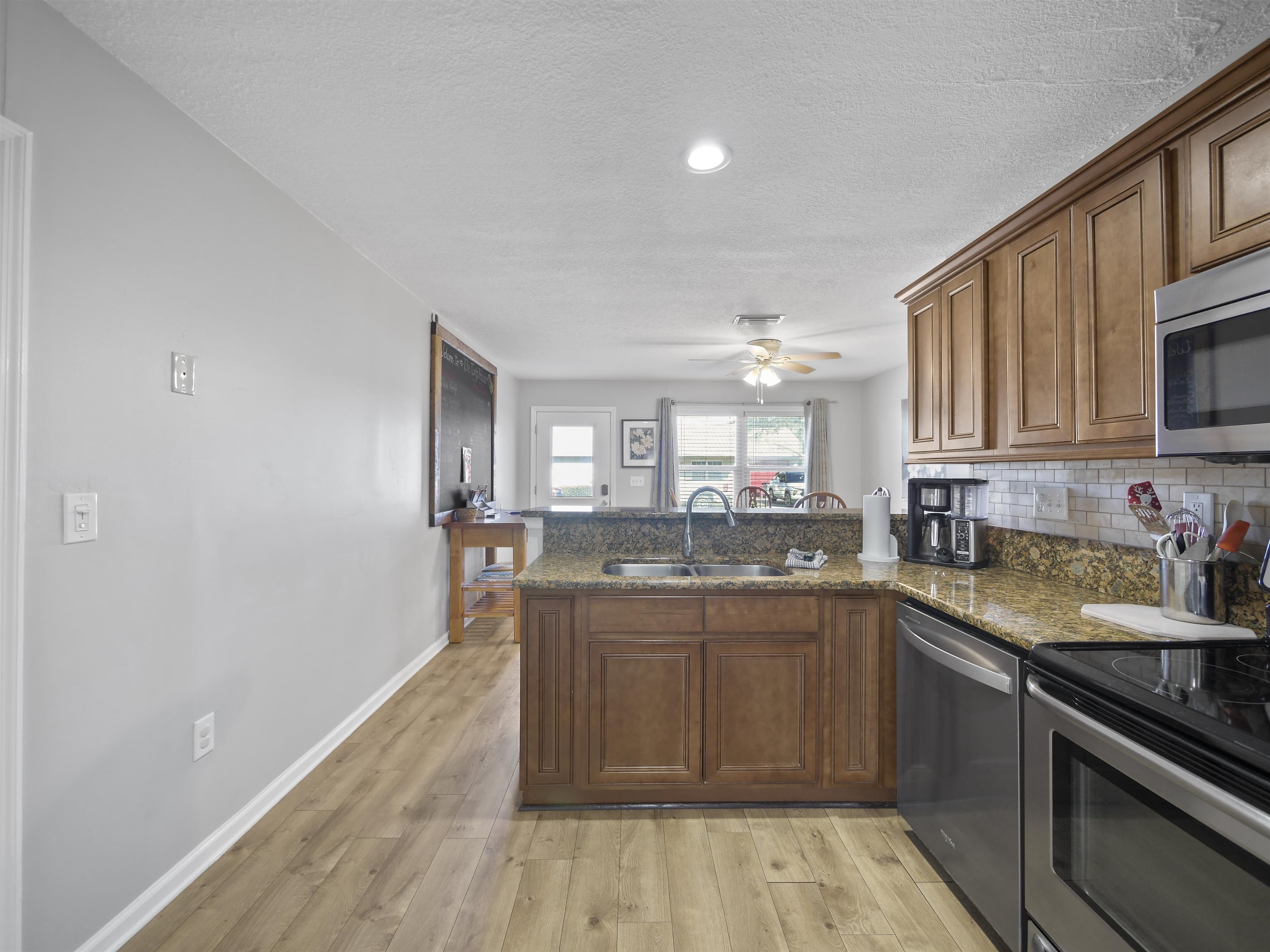 241 Tropic Way St. Augustine, FL 32080 - Photo 11 of 32 a kitchen with a sink stove and cabinets