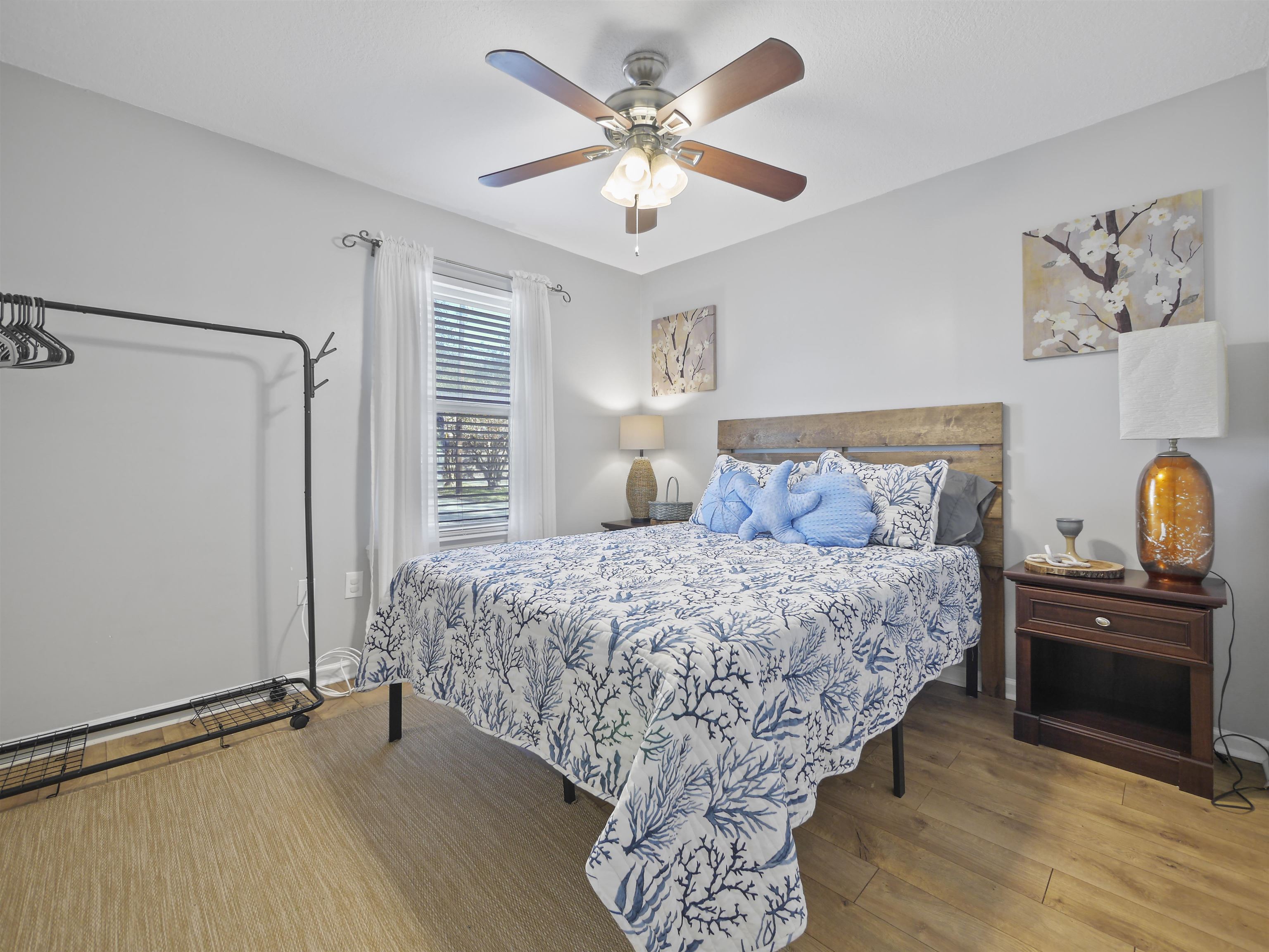 241 Tropic Way St. Augustine, FL 32080 - Photo 22 of 32 a bedroom with a bed and a chandelier