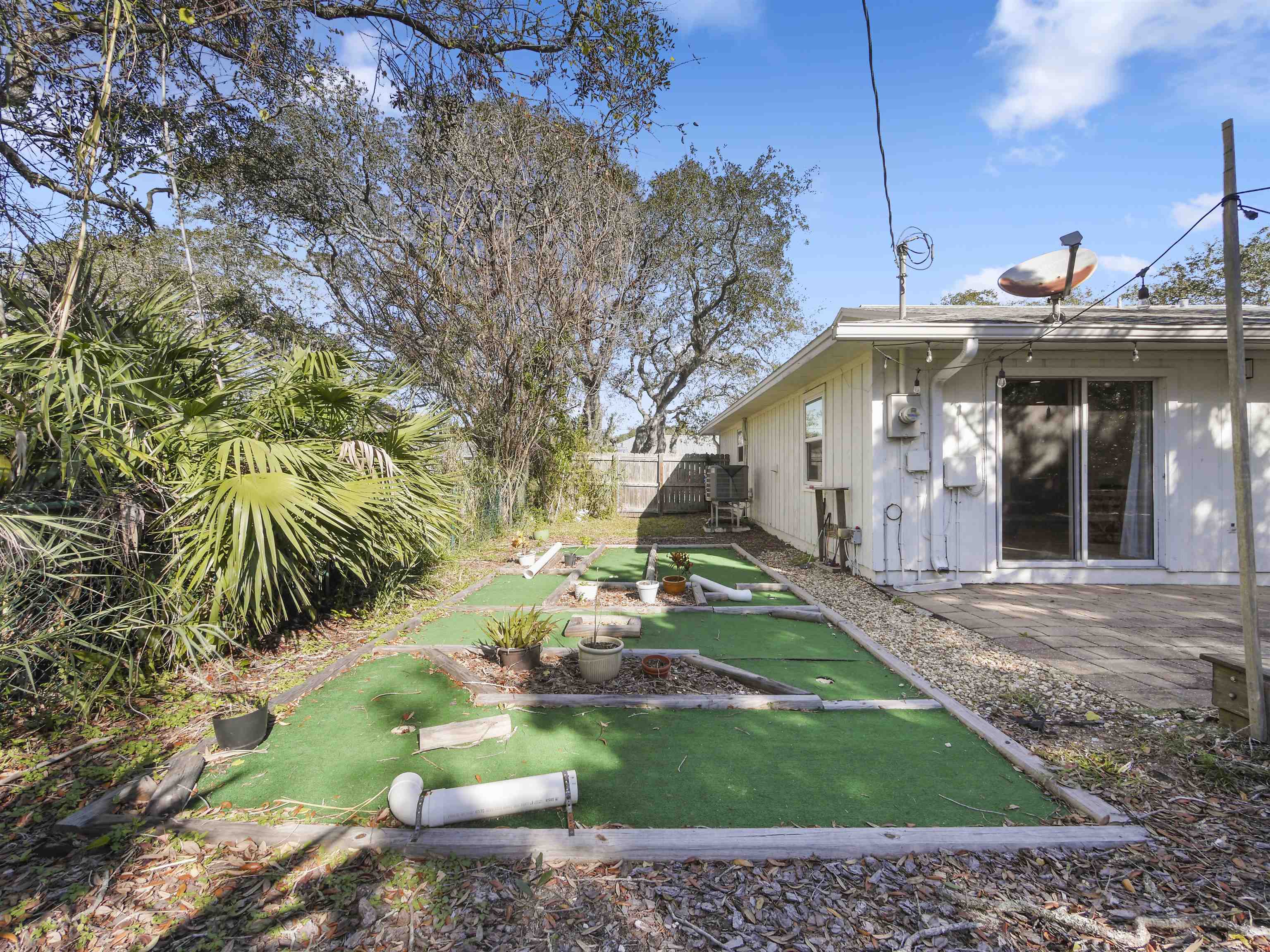 241 Tropic Way St. Augustine, FL 32080 - Photo 27 of 32 a view of a house with a yard