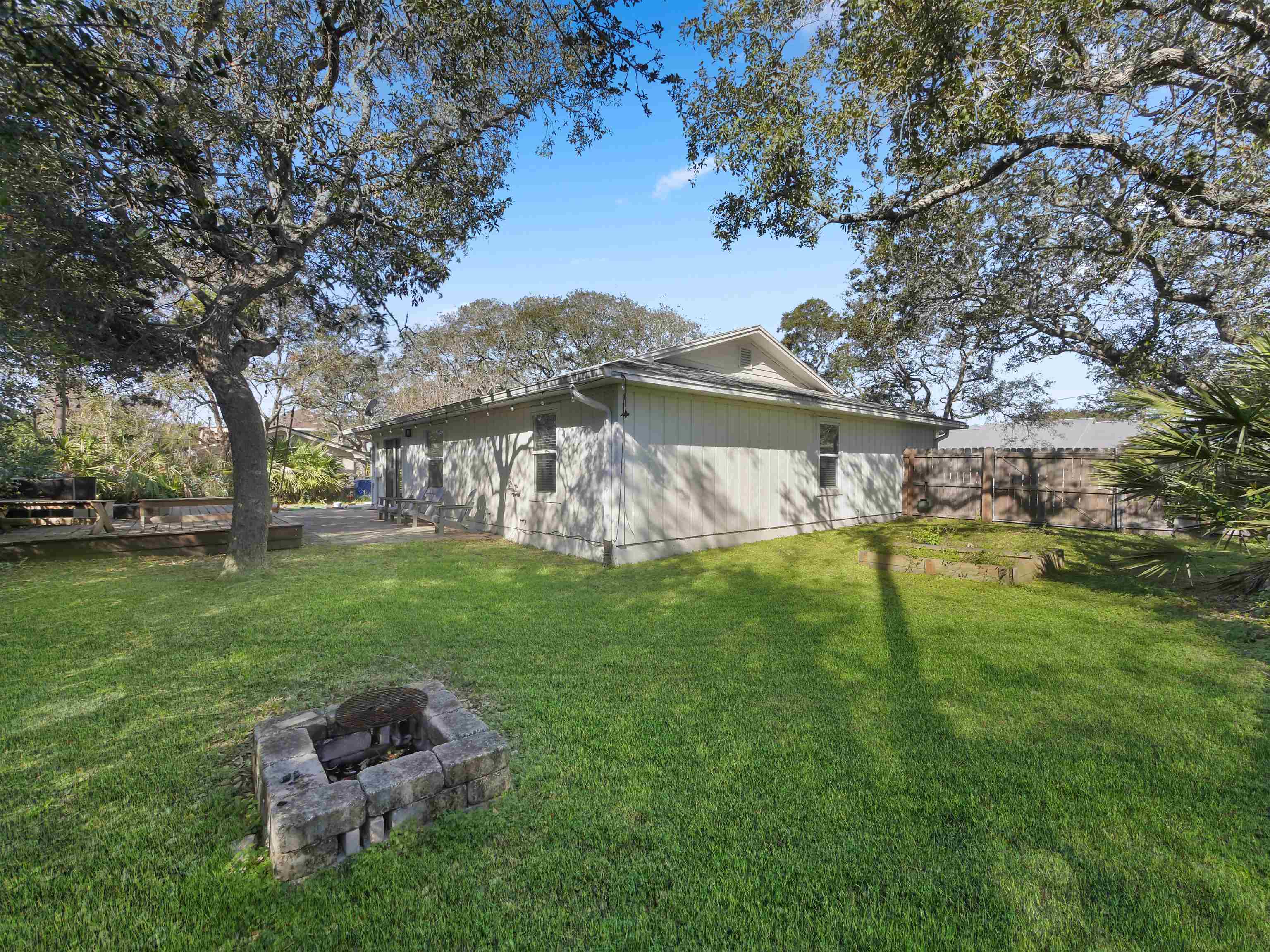 241 Tropic Way St. Augustine, FL 32080 - Photo 28 of 32 a backyard of a house with lots of green space
