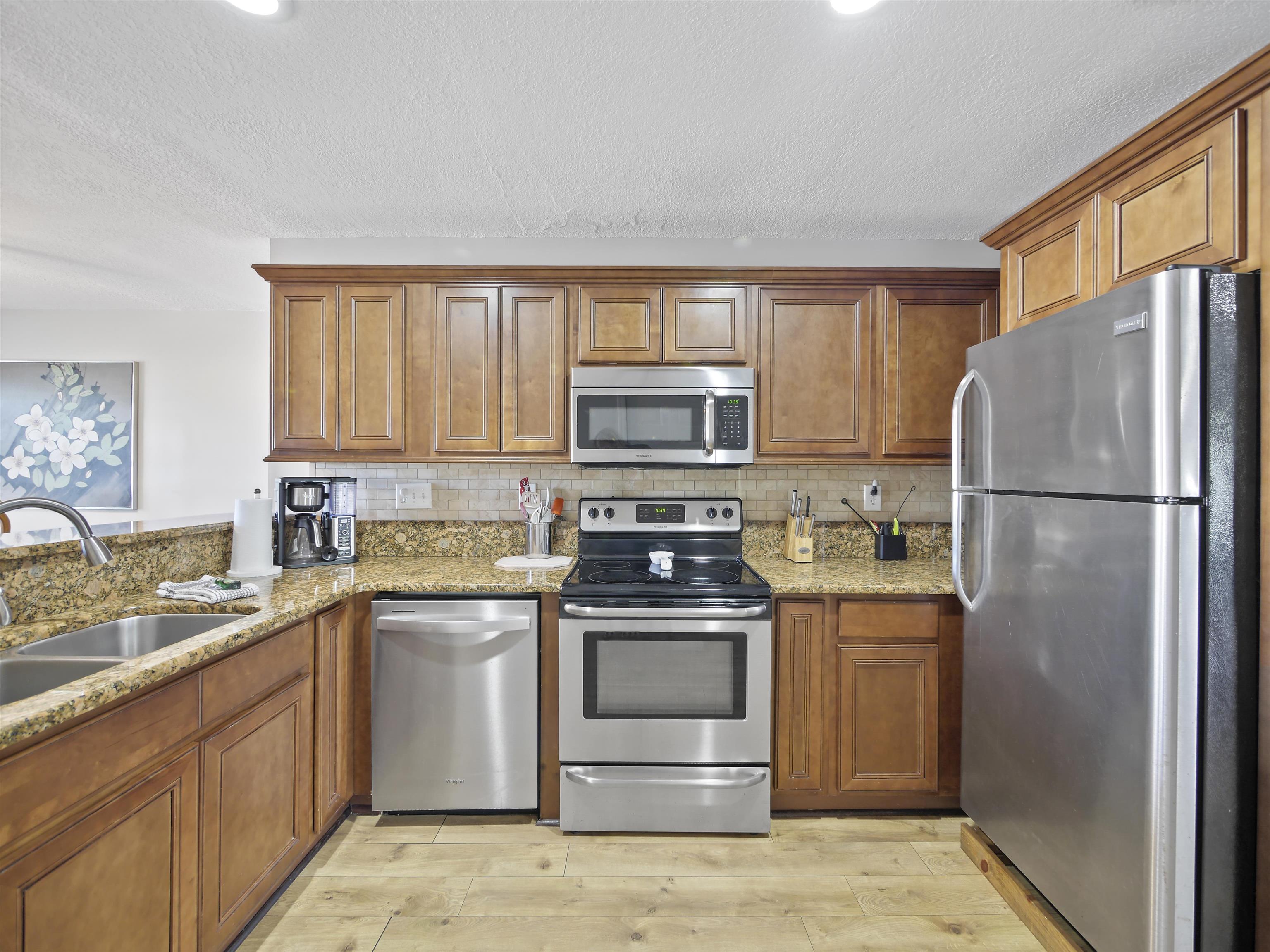 241 Tropic Way St. Augustine, FL 32080 - Photo 3 of 32 a kitchen with a sink stove and refrigerator