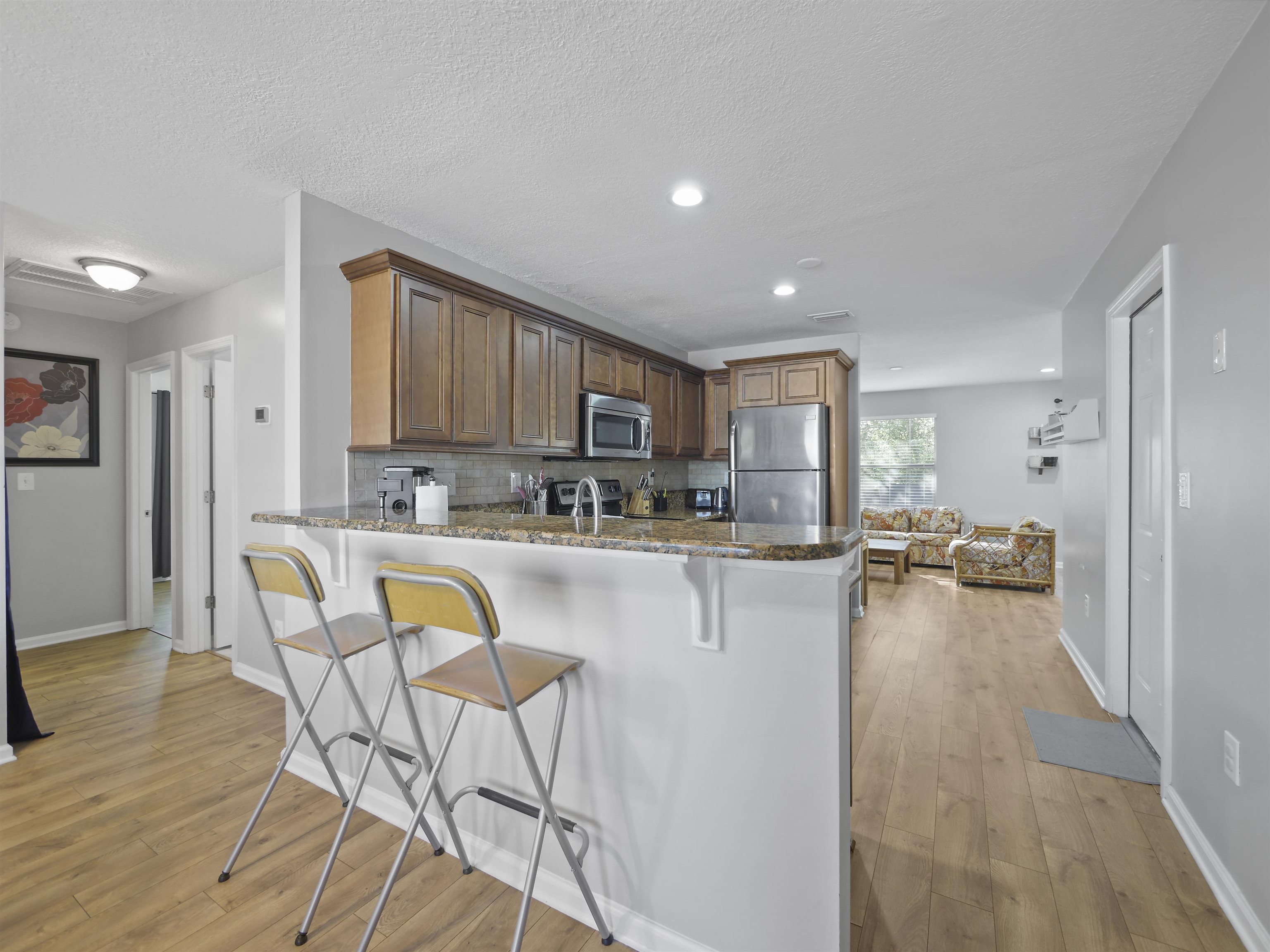 241 Tropic Way St. Augustine, FL 32080 - Photo 8 of 32 a kitchen with dining table and chairs
