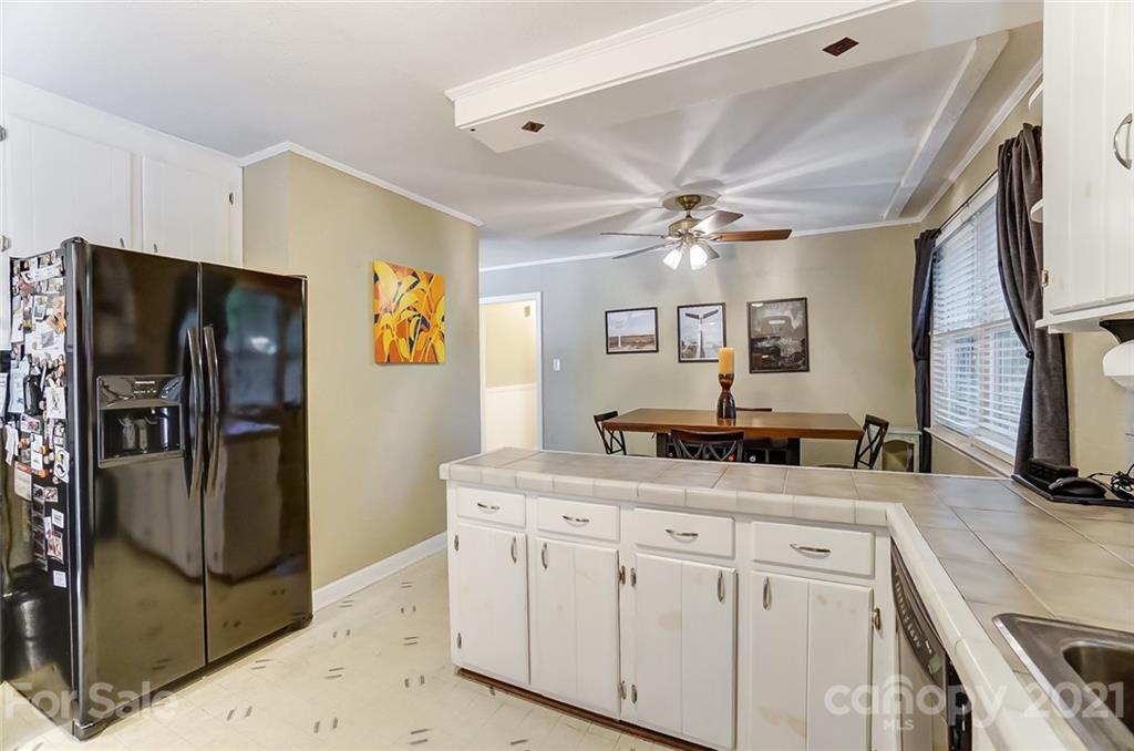 4460 Applegate Road Charlotte, NC 28209 - Photo 12 of 41 a kitchen with a refrigerator sink and stove
