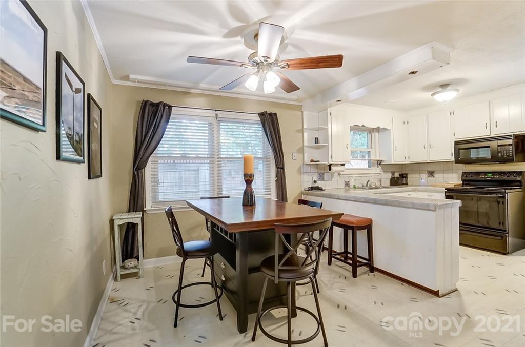 4460 Applegate Road Charlotte, NC 28209 - Photo 14 of 41 a dining room with furniture and window
