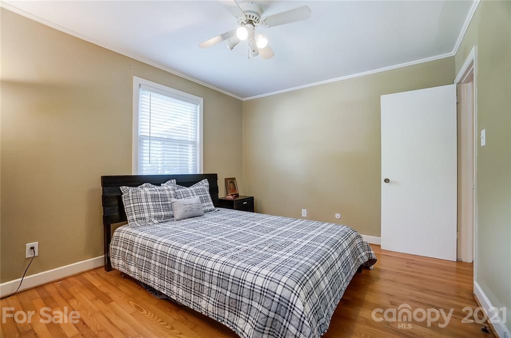 4460 Applegate Road Charlotte, NC 28209 - Photo 22 of 41 a bedroom with a bed and window