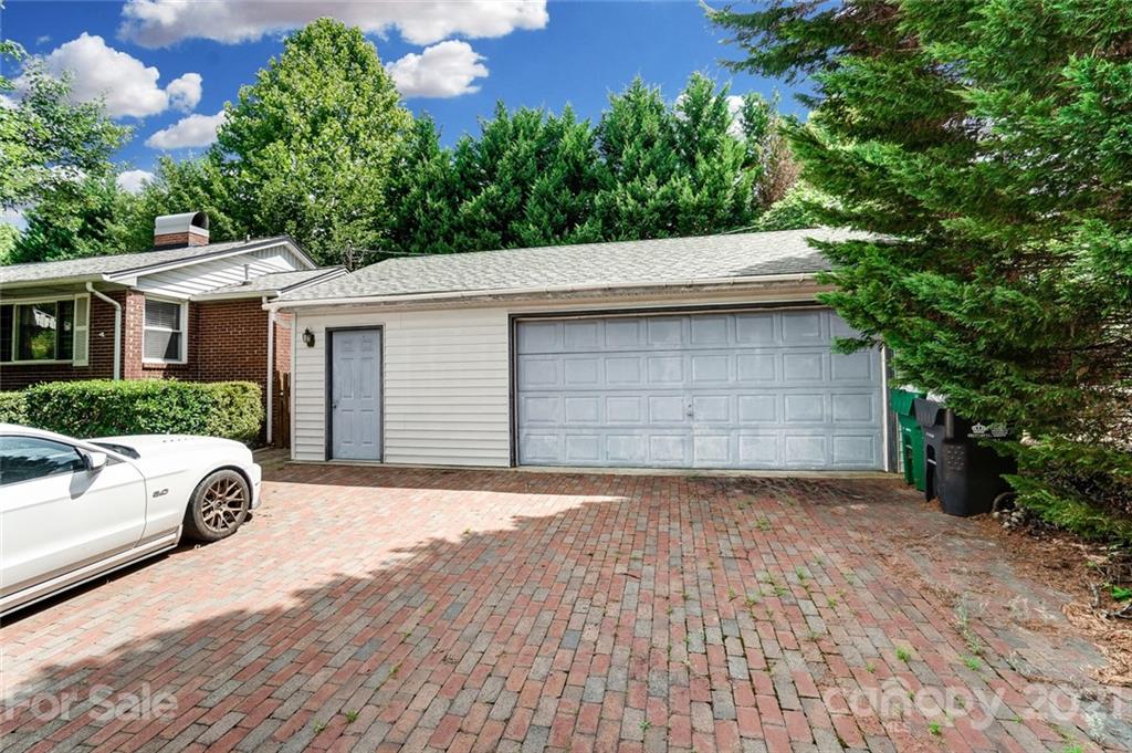 4460 Applegate Road Charlotte, NC 28209 - Photo 4 of 41 a front view of a house with a yard