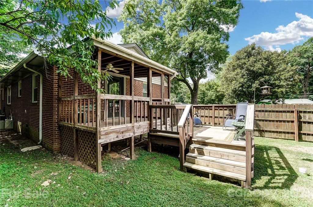 4460 Applegate Road Charlotte, NC 28209 - Photo 32 of 41 a view of a deck with a chair and white fence