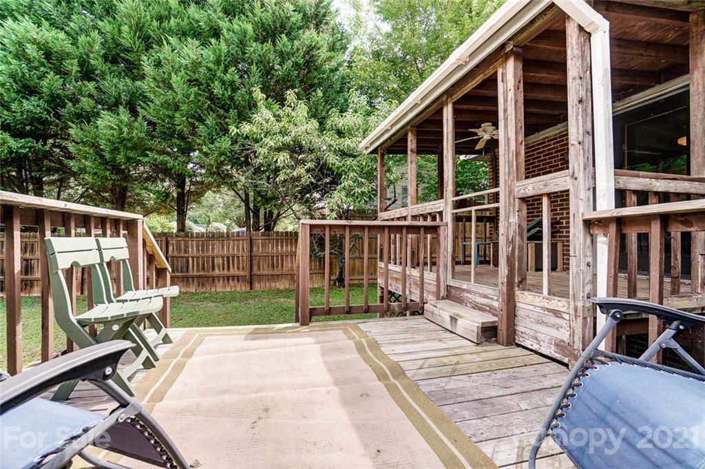 4460 Applegate Road Charlotte, NC 28209 - Photo 33 of 41 a view of a house with backyard and wooden deck