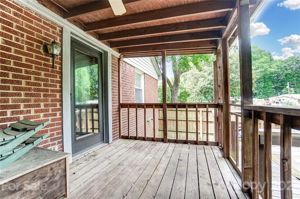 4460 Applegate Road Charlotte, NC 28209 - Photo 34 of 41 a view of a balcony with wooden floor