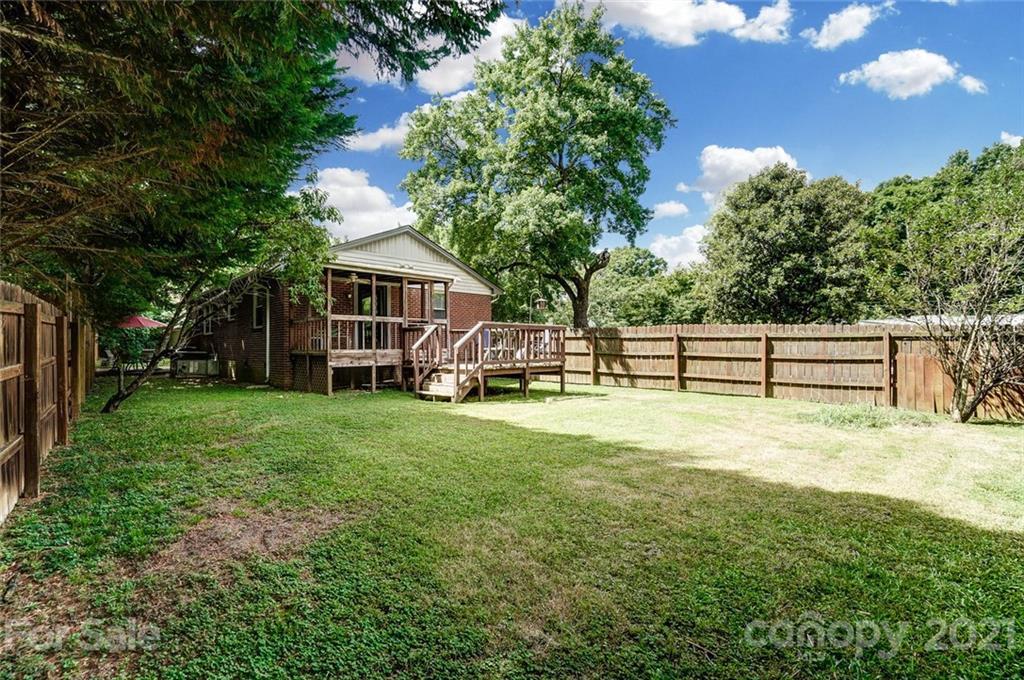 4460 Applegate Road Charlotte, NC 28209 - Photo 39 of 41 a view of a house with backyard and a tree