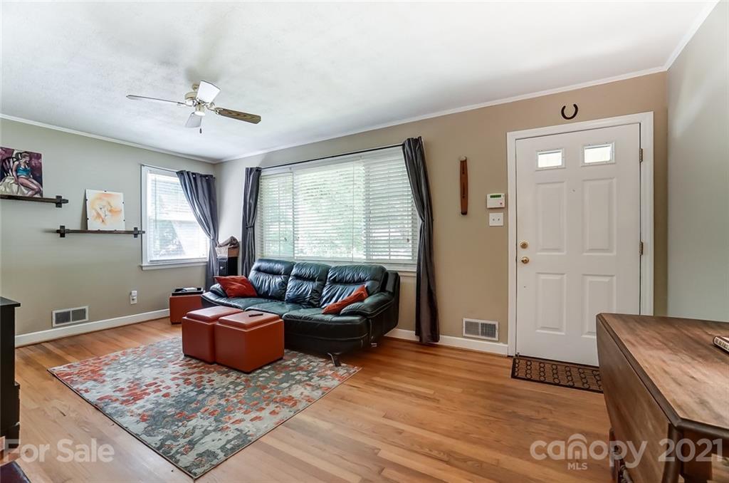4460 Applegate Road Charlotte, NC 28209 - Photo 5 of 41 a living room with furniture and a rug