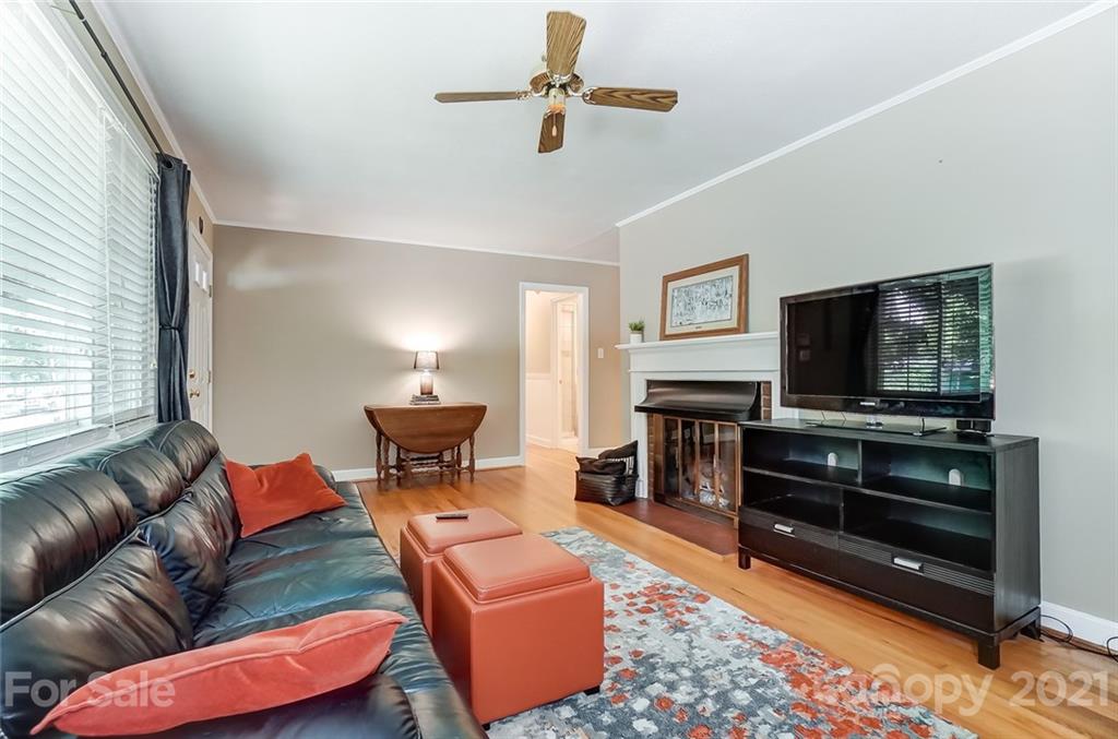 4460 Applegate Road Charlotte, NC 28209 - Photo 7 of 41 a living room with furniture and a flat screen tv