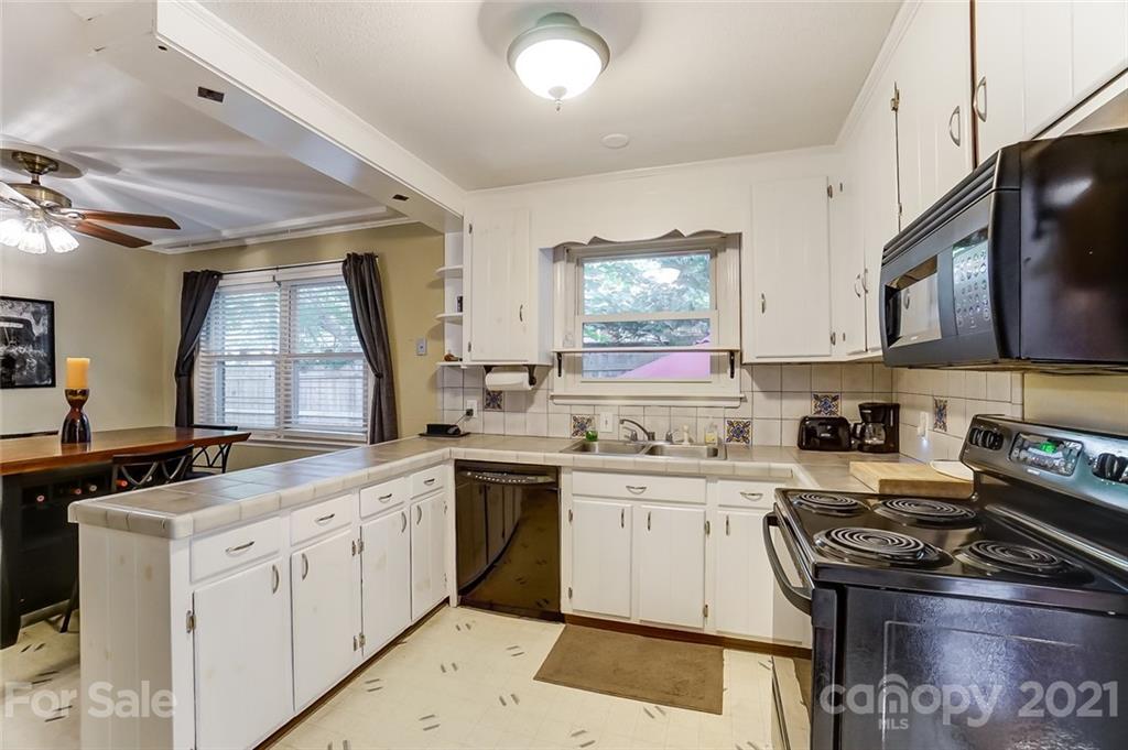 4460 Applegate Road Charlotte, NC 28209 - Photo 10 of 41 a kitchen with a sink stove and microwave