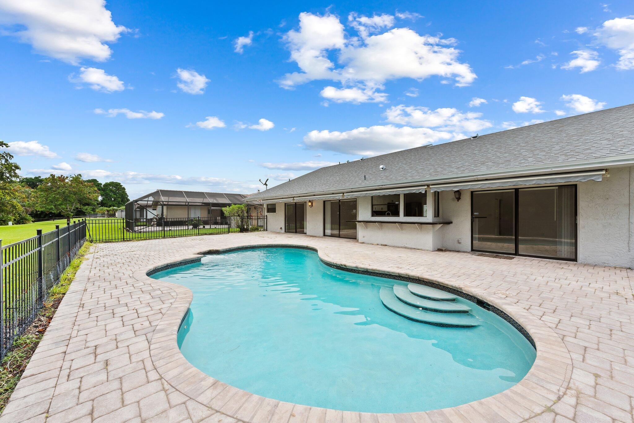 9718 Lancaster Place Boca Raton, FL 33434 - Photo 15 of 16 Fenced Yard and Pool Deck