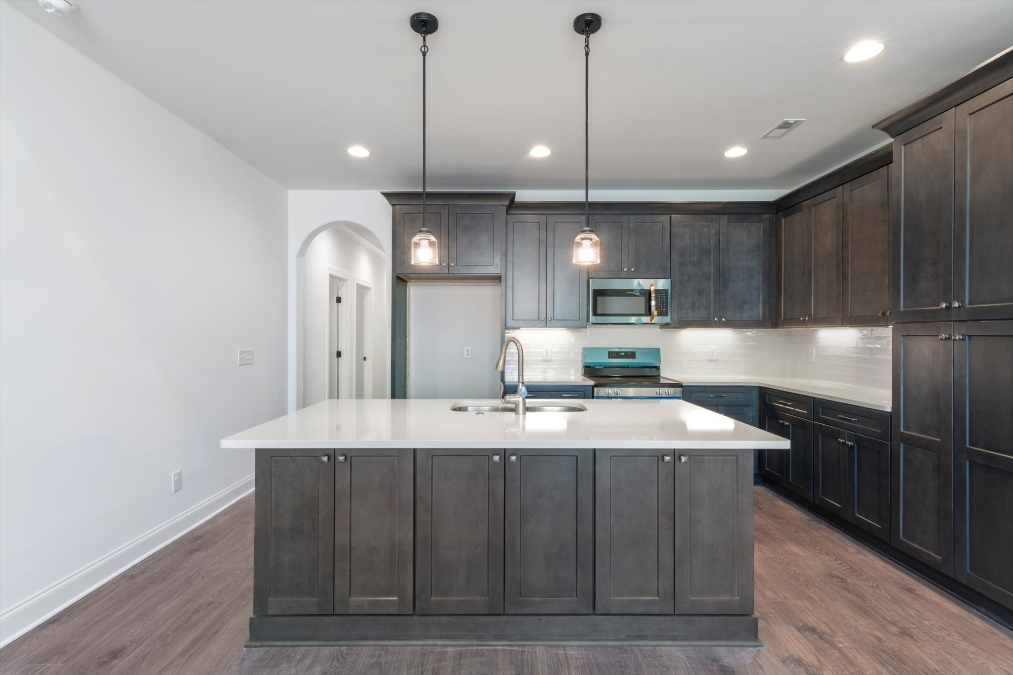 489 West Foxrun Springfield, TN 37172 - Photo 4 of 20 a large kitchen with a large counter top space a sink and stainless steel appliances