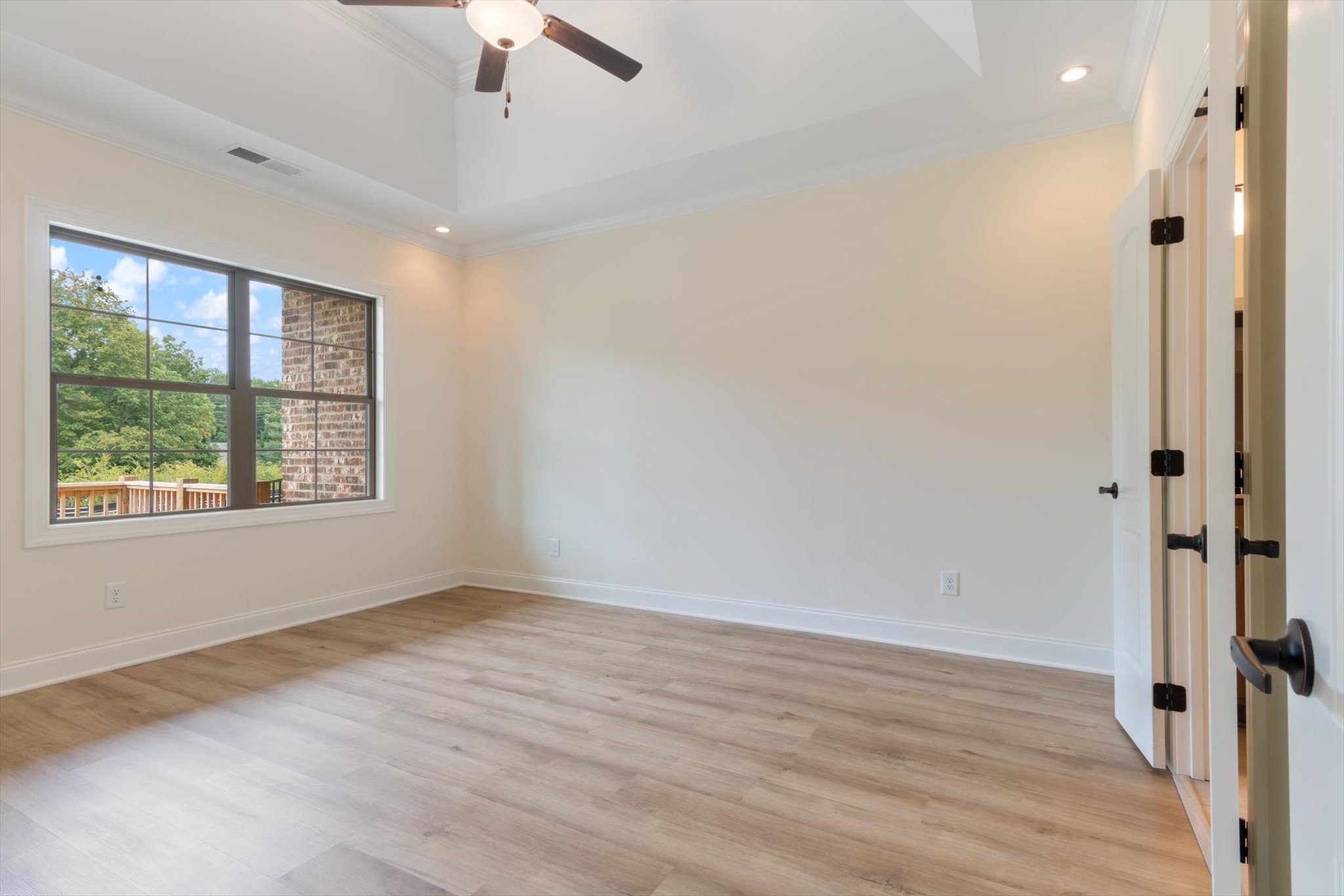 489 West Foxrun Springfield, TN 37172 - Photo 7 of 20 an empty room with wooden floor chandelier fan and windows