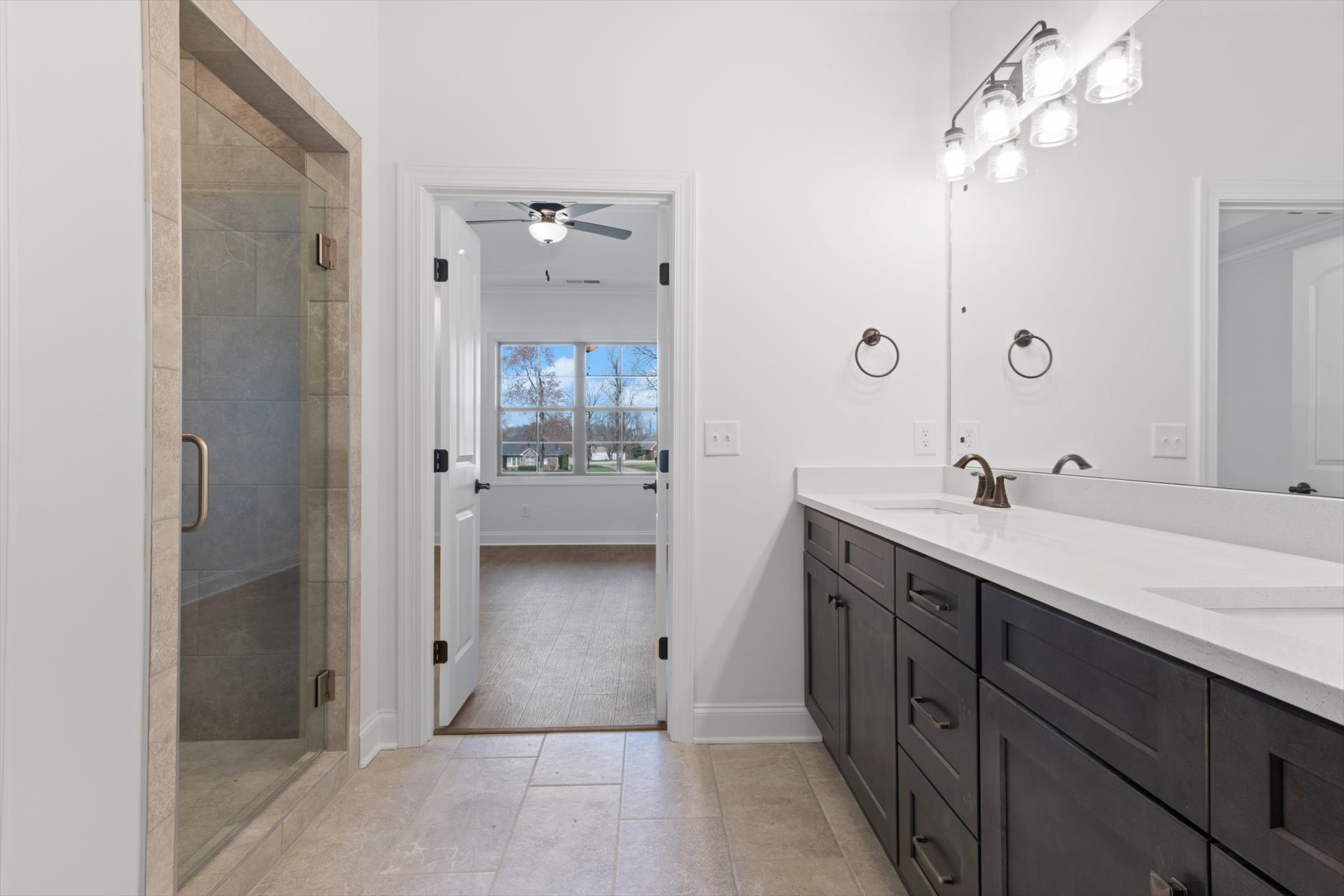489 West Foxrun Springfield, TN 37172 - Photo 10 of 20 a spacious bathroom with a shower sink and mirror