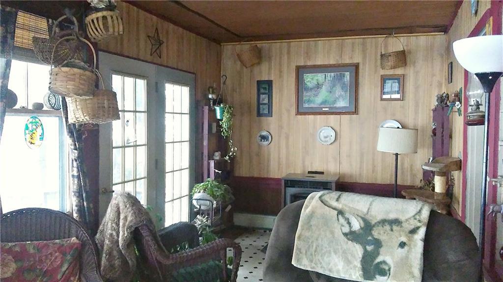 1204 Canada Road Moscow, ME 04920 - Photo 13 of 23 Living Room with French Doors to Deck