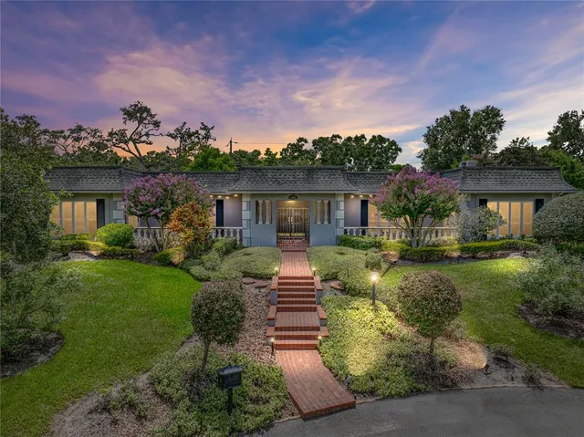 a bedroom with a bed and glass door