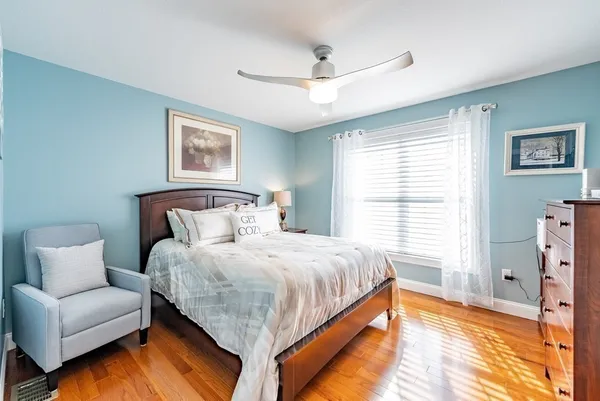 a bedroom with a bed and a couch