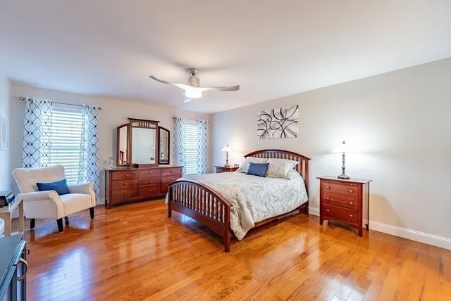 a bedroom with a bed and window