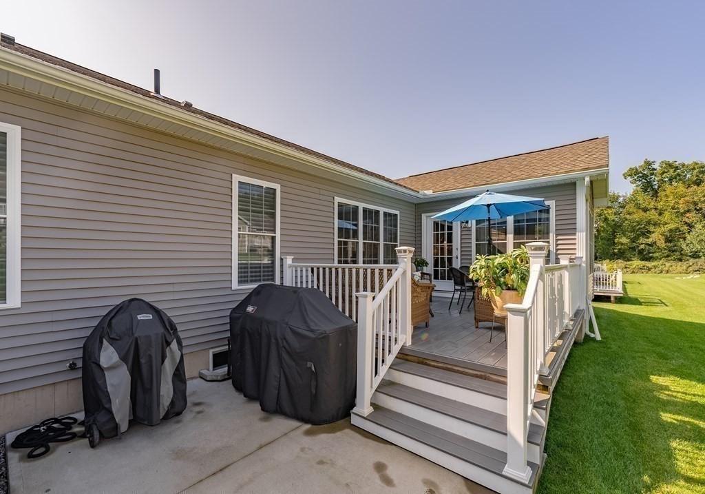 308 Miller Street, Unit 79 Ludlow, MA 01056 - Photo 20 of 20 a view of a house with backyard and porch