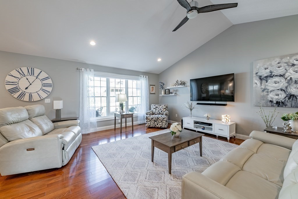 308 Miller Street, Unit 79 Ludlow, MA 01056 - Photo 6 of 20 a living room with furniture and a flat screen tv