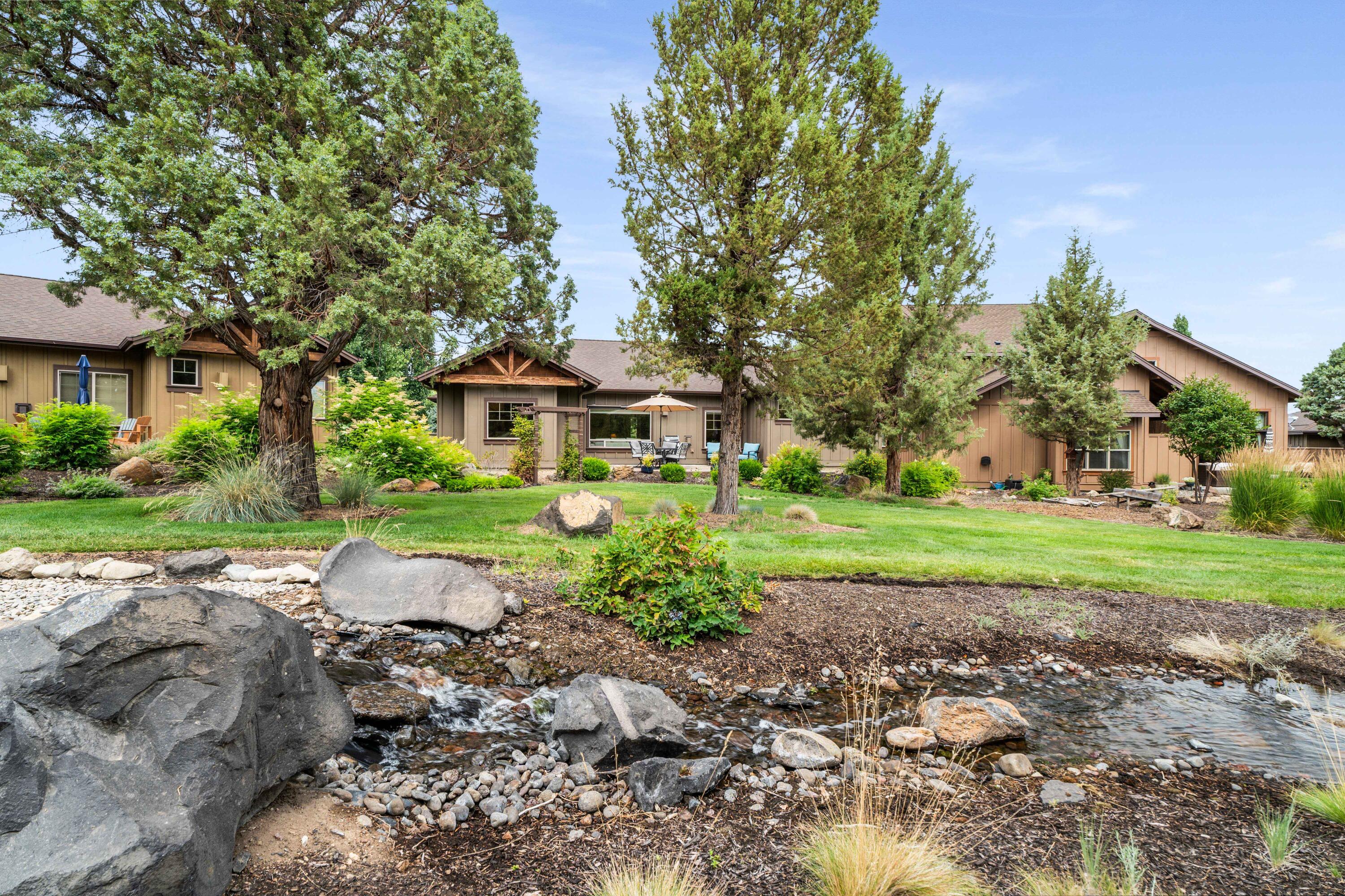 205 Vista Rim Drive Redmond, OR 97756 - Photo 35 of 85 a front view of a house with garden