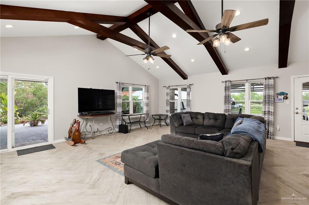 22172 North Olmito Road Rio Hondo, TX 78583 - Photo 14 of 33 a living room with furniture and a flat screen tv