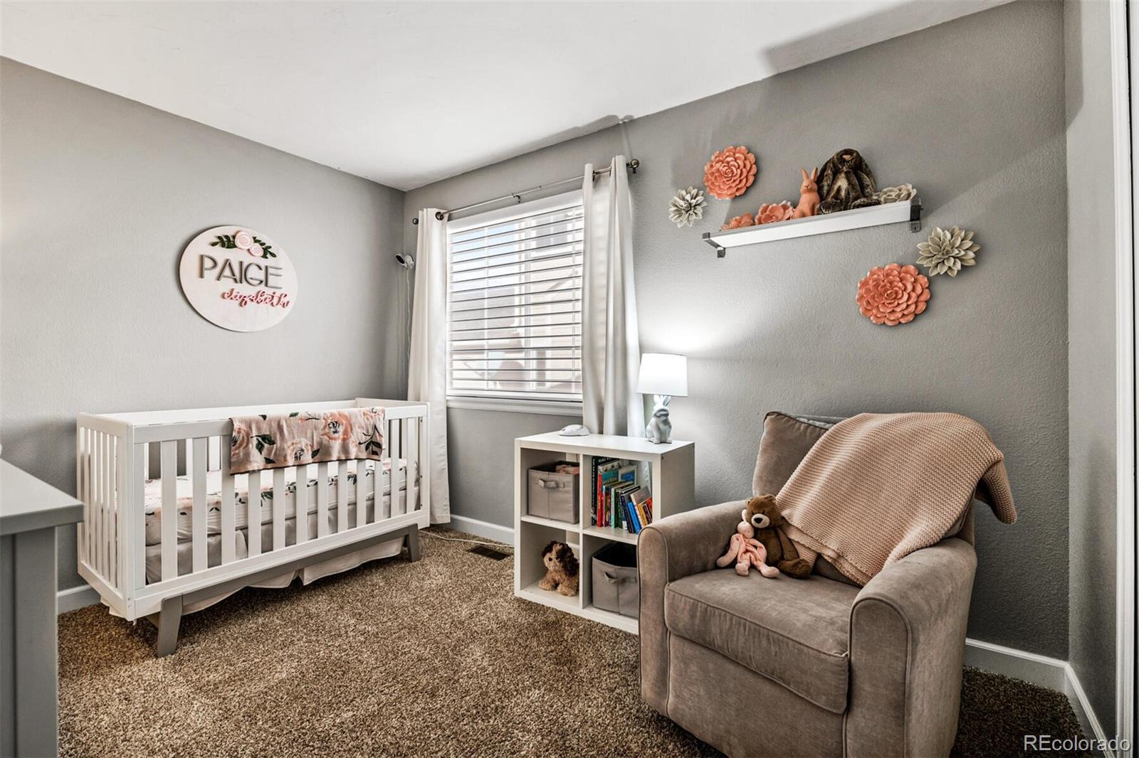 7670 Jared Way Littleton, CO 80125 - Photo 19 of 34 a bedroom with furniture and a window