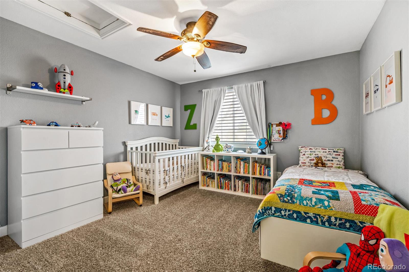 7670 Jared Way Littleton, CO 80125 - Photo 20 of 34 a bedroom with a bed and a window