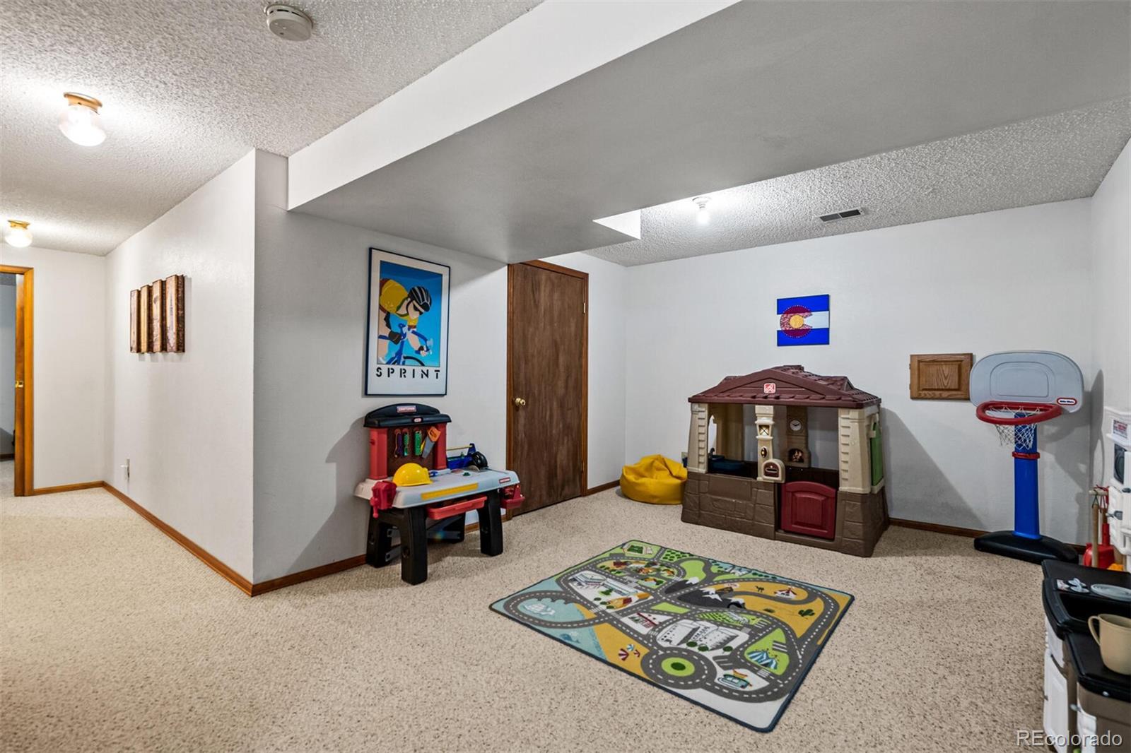 7670 Jared Way Littleton, CO 80125 - Photo 24 of 34 a living room with furniture and a couch