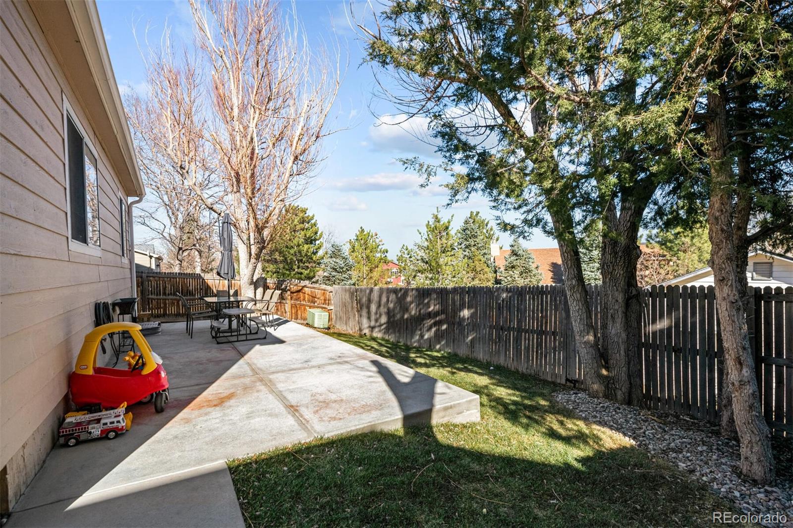 7670 Jared Way Littleton, CO 80125 - Photo 28 of 34 a view of swimming pool with wooden fence