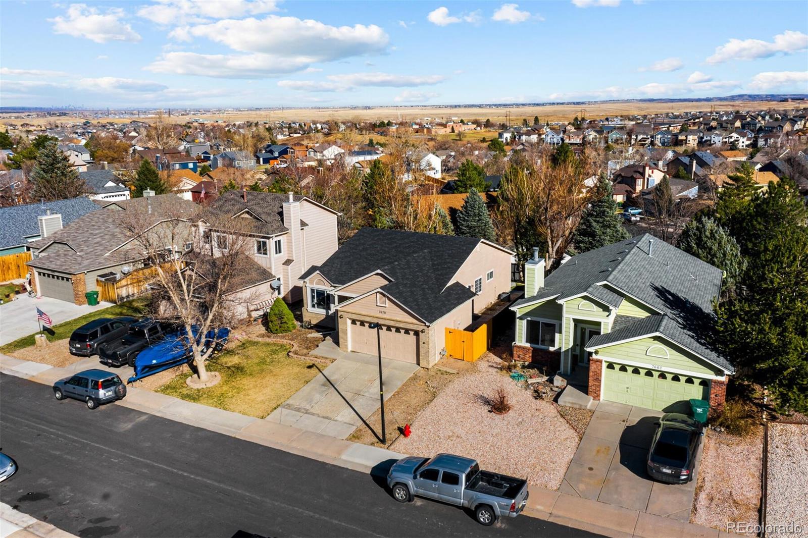 7670 Jared Way Littleton, CO 80125 - Photo 3 of 34 an aerial view of residential houses with outdoor space