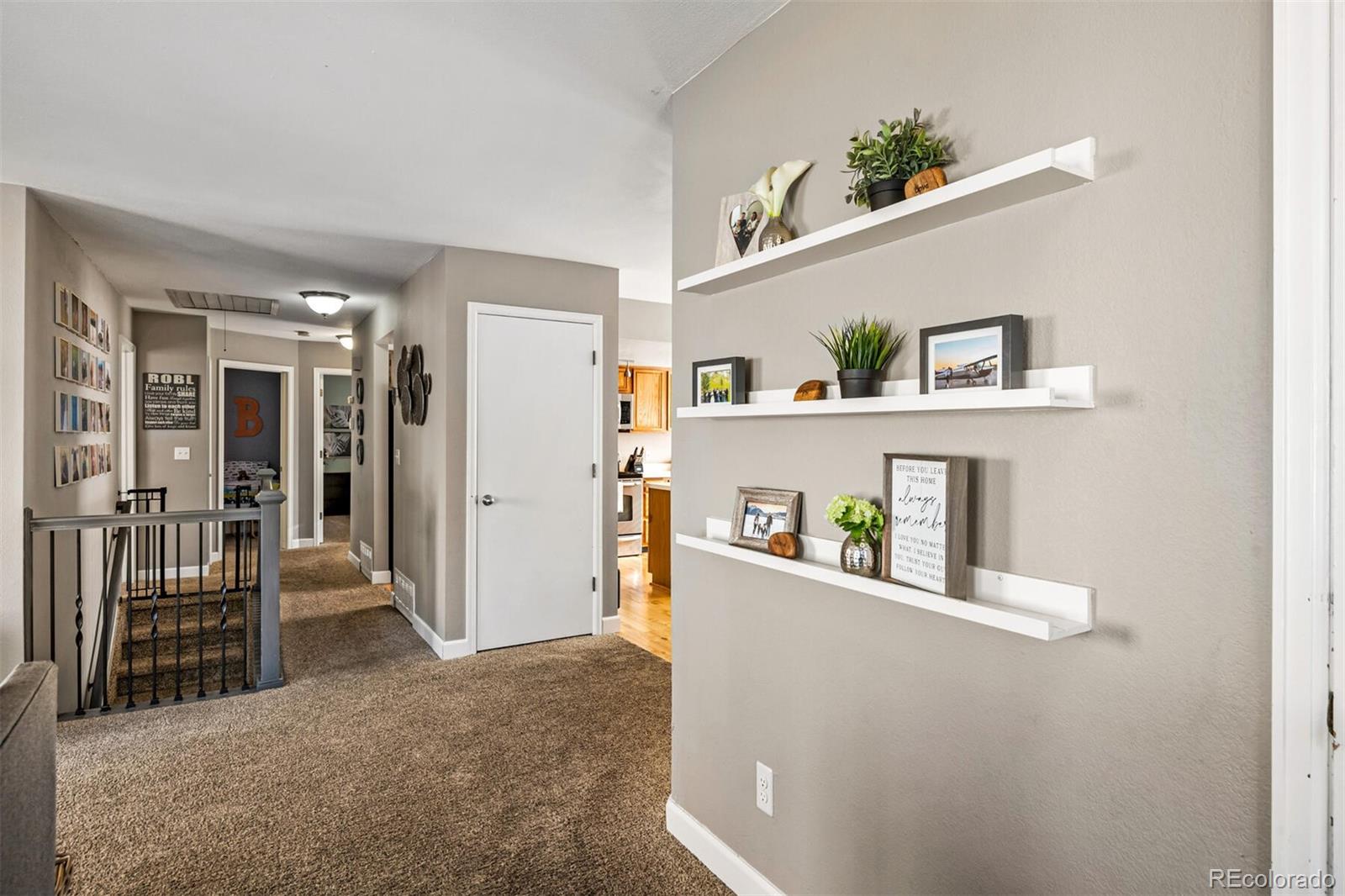 7670 Jared Way Littleton, CO 80125 - Photo 4 of 34 a view of livingroom with furniture and cabinet