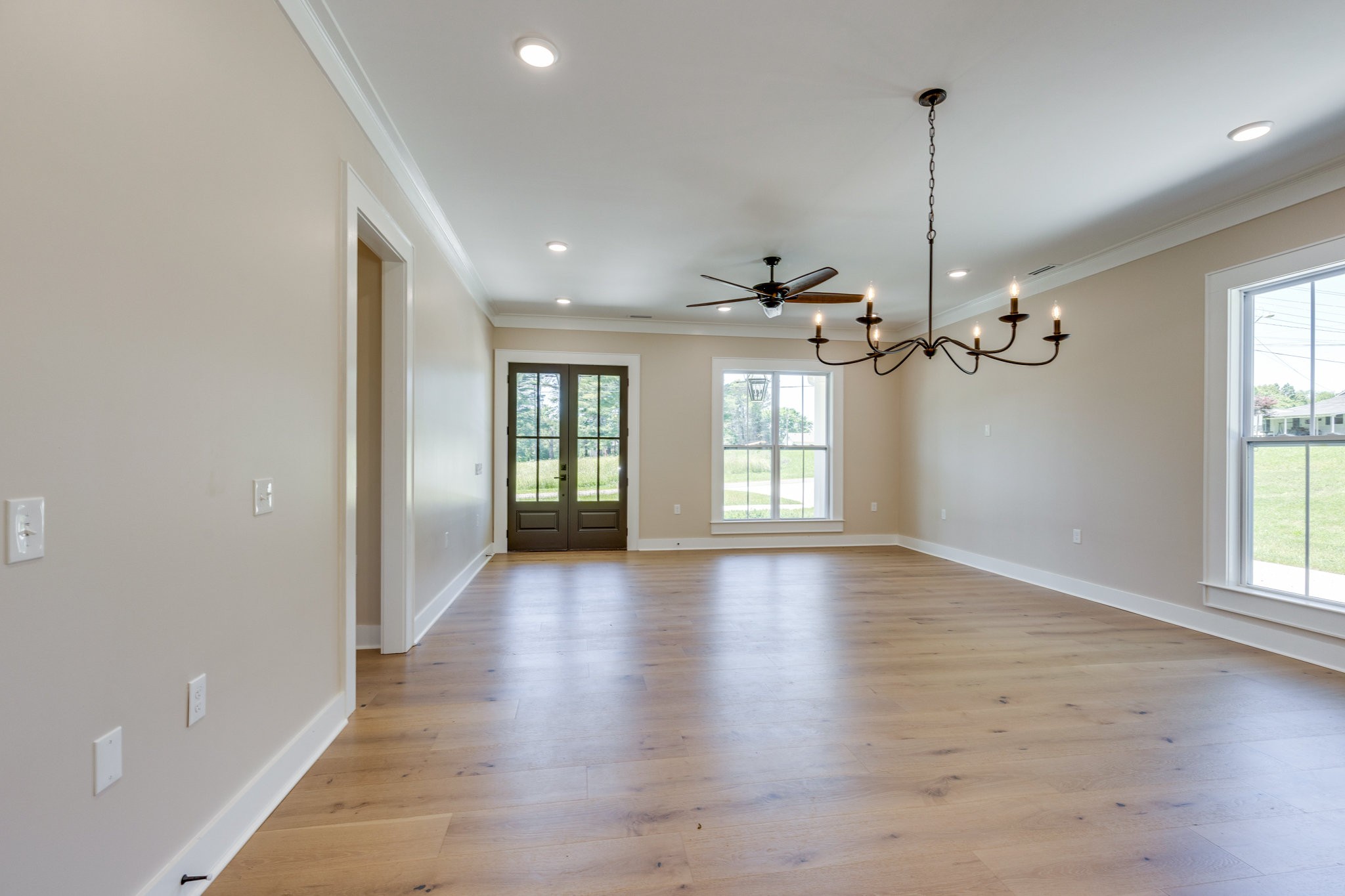 110 4th Avenue Loretto, TN 38469 - Photo 9 of 32 a view of an empty room with a window and wooden floor