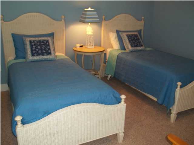 263 Winston Lane Inlet Beach, FL 32461 - Photo 13 of 21 a bed sitting in a bedroom next to a lamp