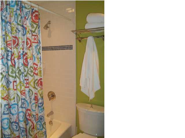 263 Winston Lane Inlet Beach, FL 32461 - Photo 16 of 21 a bathroom with a toilet and a shower curtain