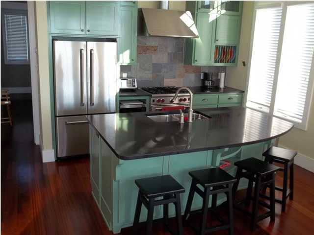 263 Winston Lane Inlet Beach, FL 32461 - Photo 6 of 21 a kitchen with stainless steel appliances granite countertop a stove a refrigerator and a dining table