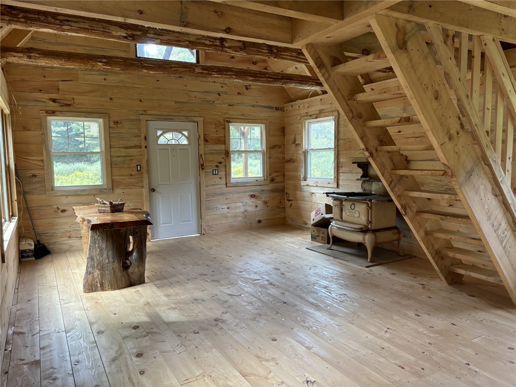 172 Hawks Road Pittsfield, NY 13411 - Photo 21 of 45 Kitchen, dining room, wood stove in cabin
