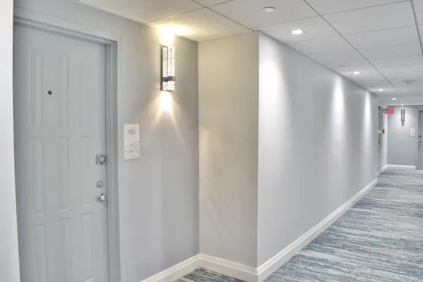 a view of an house with backyard and patio