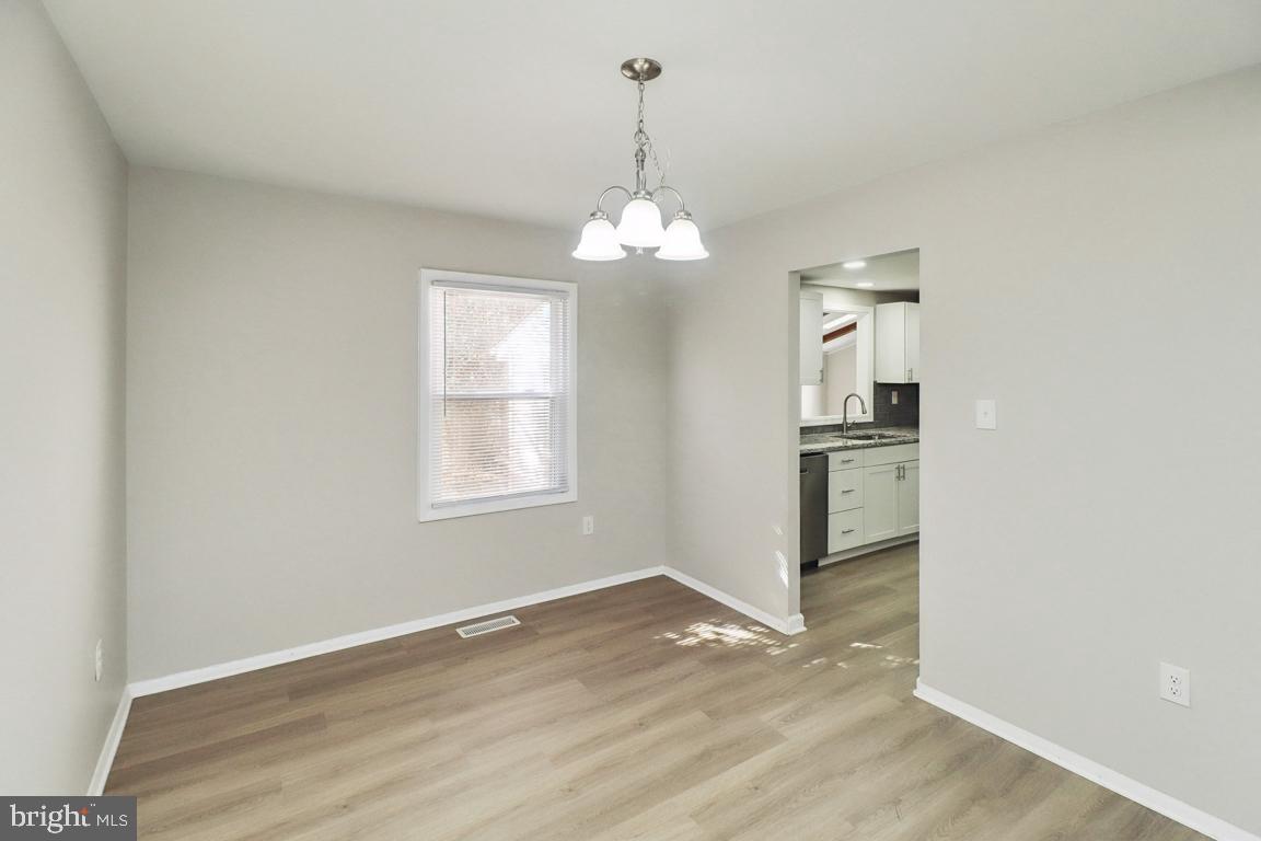 6551 Cornell Road Bryans Road, MD 20616 - Photo 7 of 25 a view of a room window and wooden floor