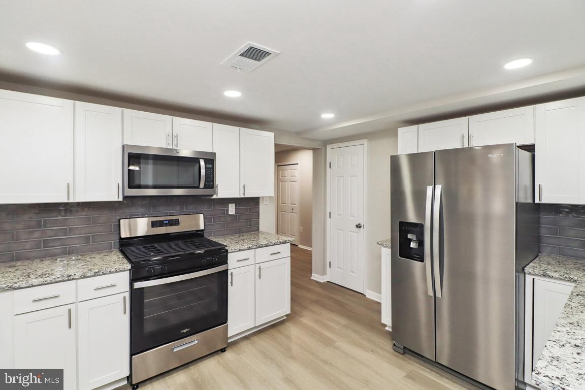 6551 Cornell Road Bryans Road, MD 20616 - Photo 8 of 25 a kitchen with a refrigerator stove and microwave