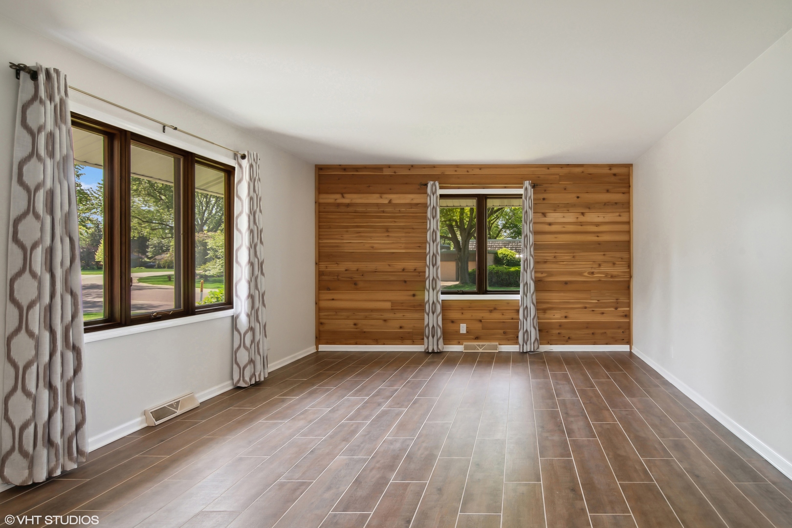 1875 Alschuler Drive Aurora, IL 60506 - Photo 3 of 16 wooden floor in an empty room with a window