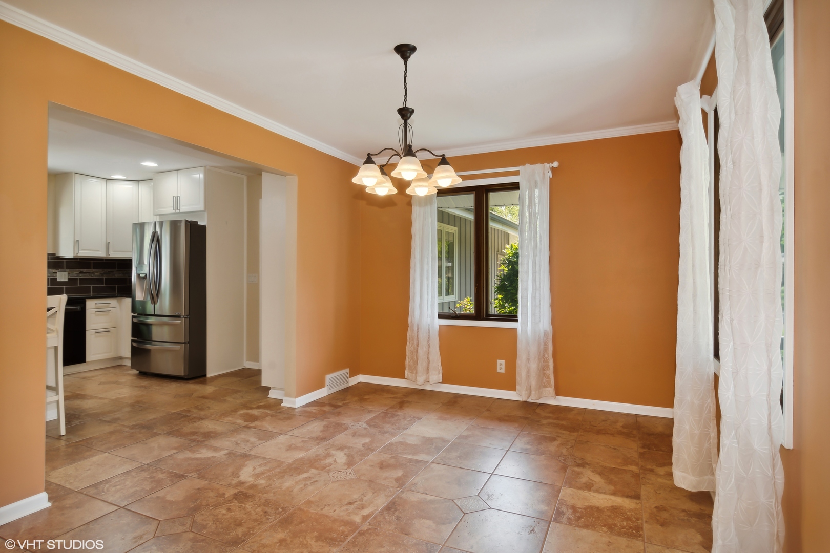 1875 Alschuler Drive Aurora, IL 60506 - Photo 4 of 16 a view of a hallway with a chandelier