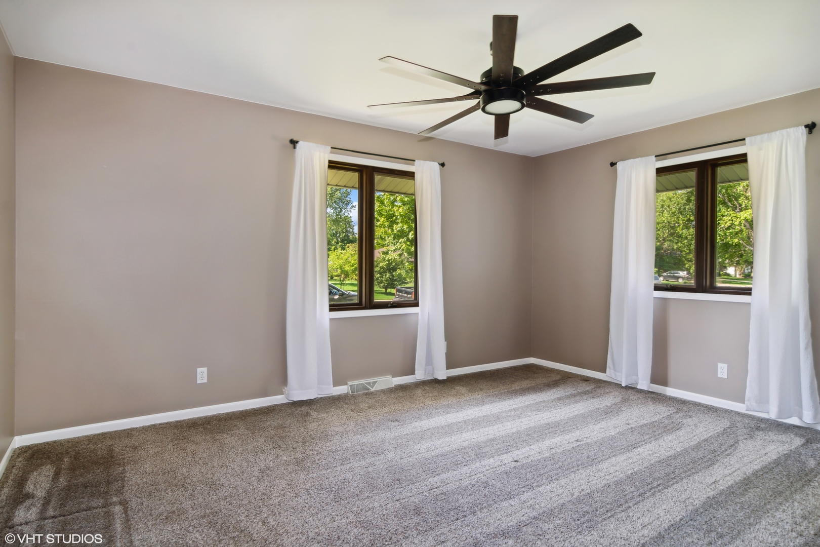 1875 Alschuler Drive Aurora, IL 60506 - Photo 8 of 16 a view of a livingroom with a ceiling fan and window