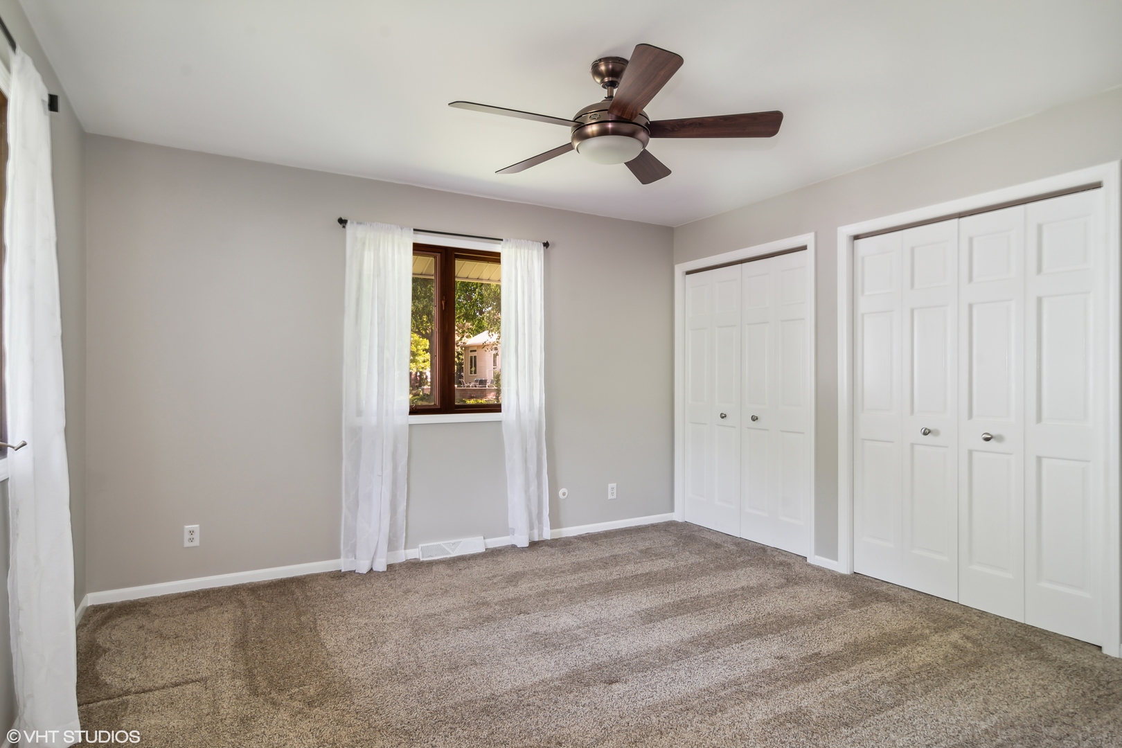 1875 Alschuler Drive Aurora, IL 60506 - Photo 9 of 16 a view of a livingroom with a hardwood floor and a ceiling fan