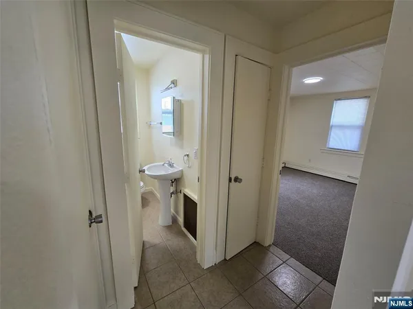 a bathroom with a sink and mirror