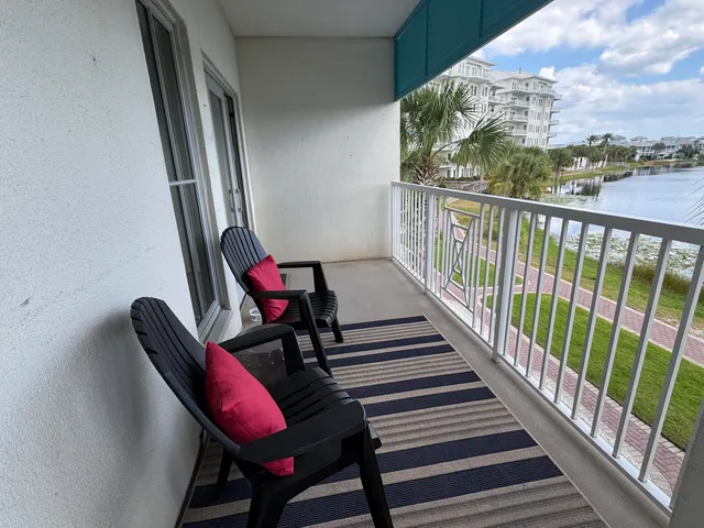 a view of a balcony with furniture